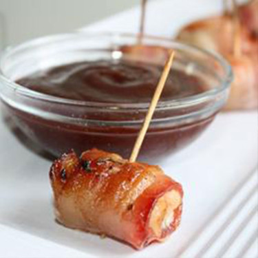 bacon wrapped chicken with a toothpick skewer